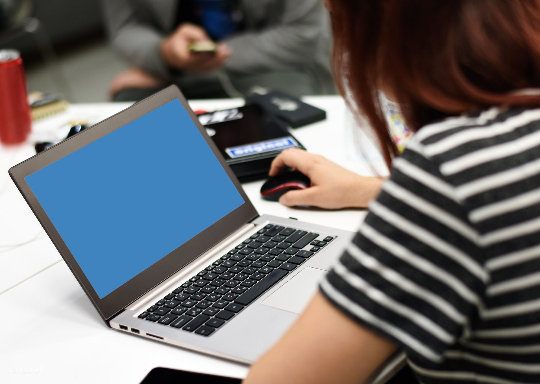 People working together around a laptop