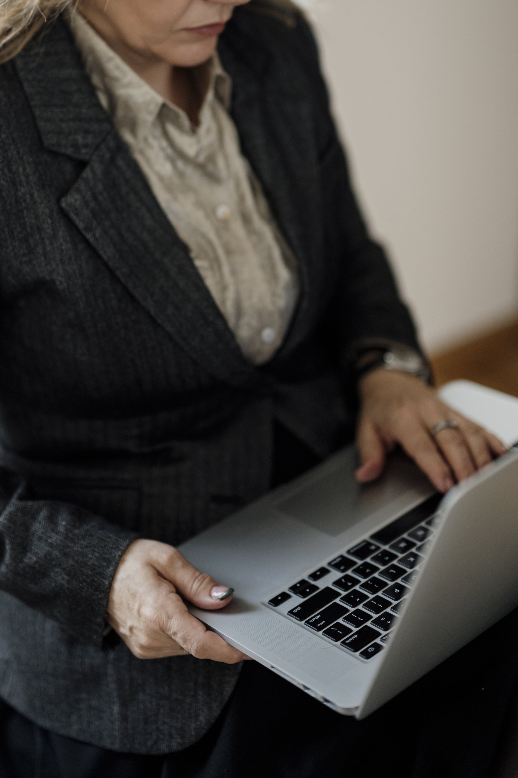 Professional woman using a laptop in a modern office